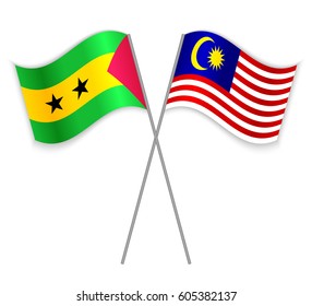 Sao Tomean and Malaysian crossed flags. Sao Tome and Principe combined with Malaysia isolated on white. Language learning, international business or travel concept.