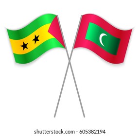 Sao Tomean and Maldivian crossed flags. Sao Tome and Principe combined with Maldives isolated on white. Language learning, international business or travel concept.