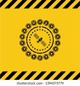satelite icon black grunge emblem with yellow background. Vector Illustration. Detailed.