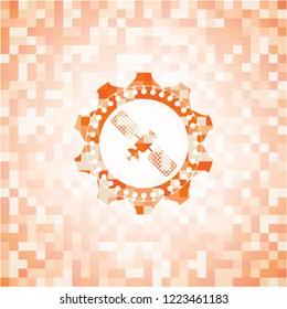 satelite icon inside abstract emblem, orange mosaic background