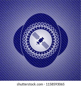 satelite icon inside badge with denim background