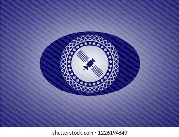 satelite icon inside badge with denim texture