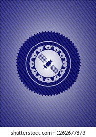 satelite icon inside badge with denim background
