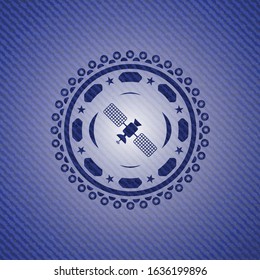 satelite icon inside badge with denim background