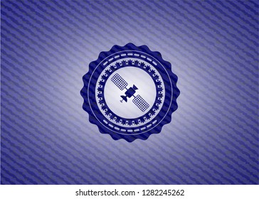 satelite icon inside badge with jean texture