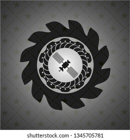 satelite icon inside black emblem