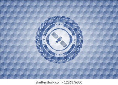 satelite icon inside blue badge with geometric pattern.