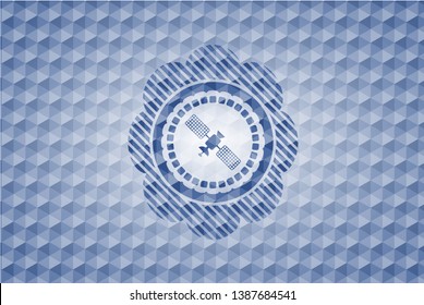 satelite icon inside blue polygonal emblem.