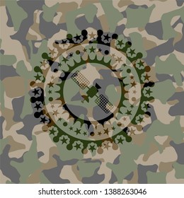 satelite icon inside camouflage emblem