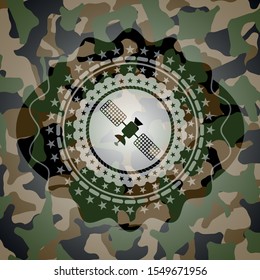 satelite icon inside camouflaged emblem