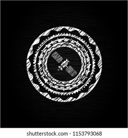 satelite icon inside chalkboard emblem written on a blackboard