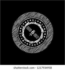 satelite icon inside chalkboard emblem on black board