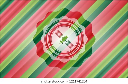 satelite icon inside christmas colors emblem.