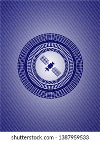 satelite icon inside denim background