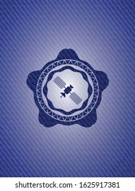 satelite icon inside emblem with denim high quality background