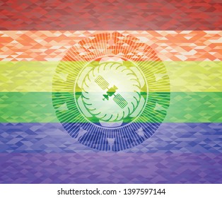 satelite icon inside emblem on mosaic background with the colors of the LGBT flag