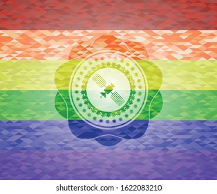 satelite icon inside emblem on mosaic background with the colors of the LGBT flag