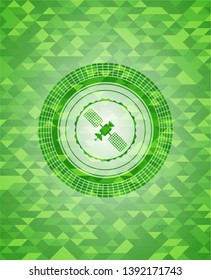 satelite icon inside green emblem with triangle mosaic background