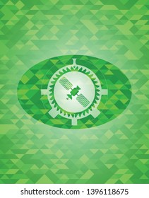 satelite icon inside green emblem. Mosaic background