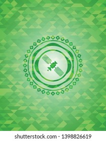 satelite icon inside green emblem. Mosaic background