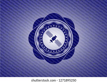 satelite icon inside jean or denim emblem or badge background