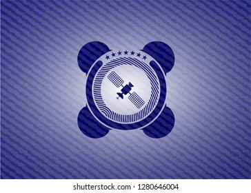 satelite icon inside jean or denim emblem or badge background