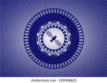 satelite icon inside jean or denim emblem or badge background