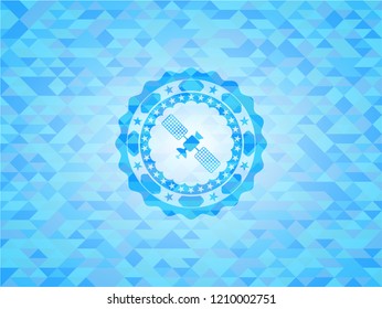 satelite icon inside light blue emblem with mosaic background