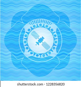 satelite icon inside light blue water wave badge.