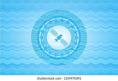 satelite icon inside light blue water emblem background.
