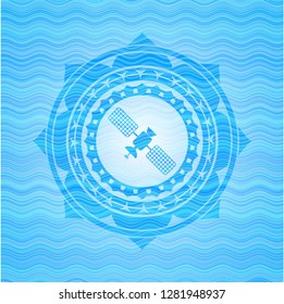 satelite icon inside light blue water wave style badge.