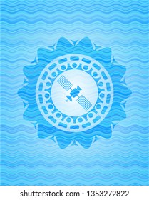 satelite icon inside light blue water wave emblem.