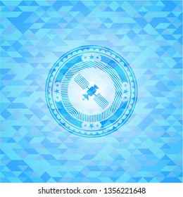 satelite icon inside light blue mosaic emblem