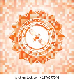 satelite icon inside orange mosaic emblem
