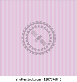 satelite icon inside pink emblem