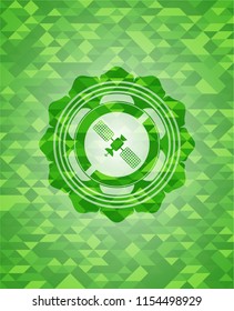 satelite icon inside realistic green mosaic emblem