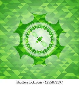 satelite icon inside realistic green mosaic emblem