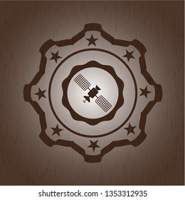 satelite icon inside realistic wooden emblem