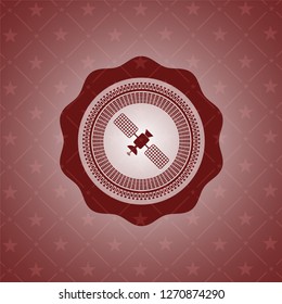satelite icon inside red emblem