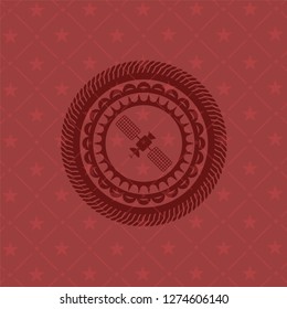 satelite icon inside red emblem