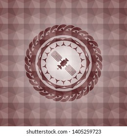 satelite icon inside red seamless emblem or badge with abstract geometric pattern background.