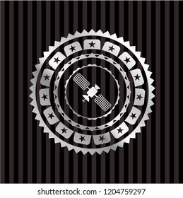 satelite icon inside silver emblem or badge
