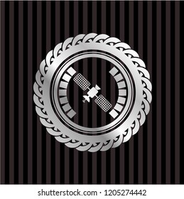 satelite icon inside silver emblem