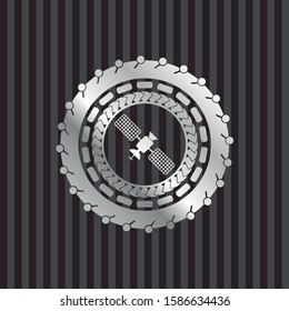satelite icon inside silver shiny badge