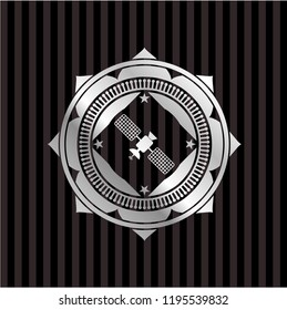 satelite icon inside silvery badge or emblem