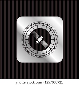 satelite icon inside silvery badge or emblem
