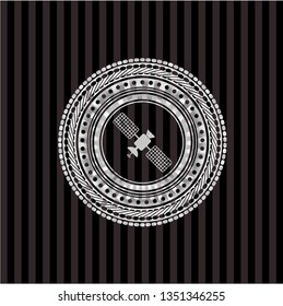 satelite icon inside silvery badge or emblem