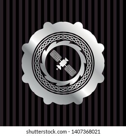 satelite icon inside silvery badge
