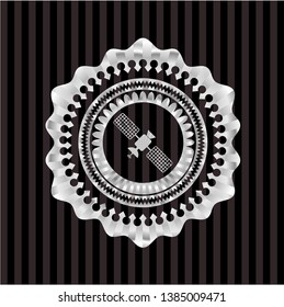 satelite icon inside silvery emblem or badge