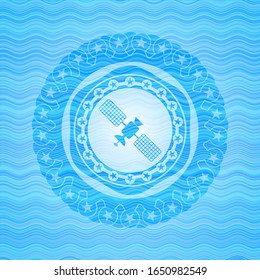 satelite icon inside sky blue water wave emblem background.